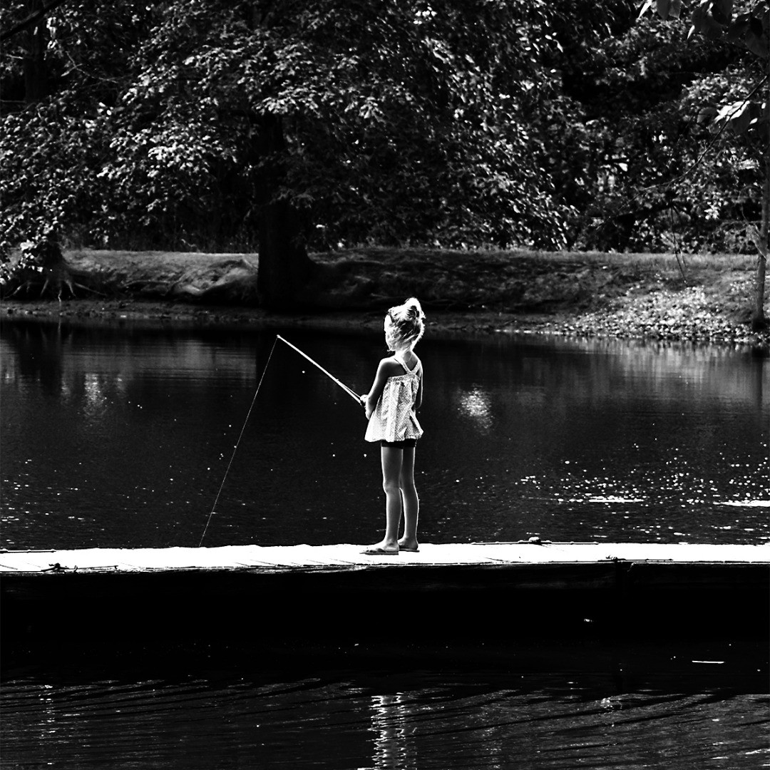 Girl Fishing on Dock